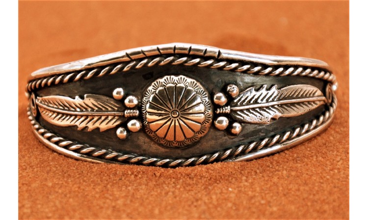 Native american concho and feathers bracelet